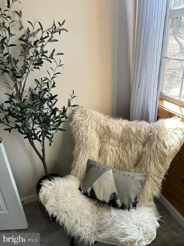 a view of a patio with a table chairs and a fire pit
