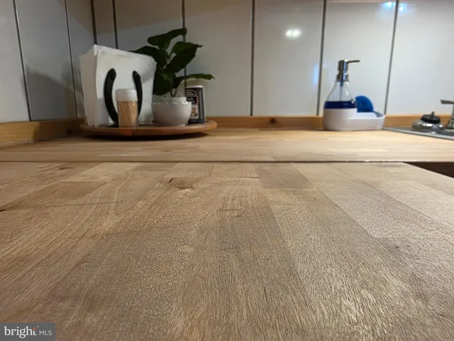 a kitchen with a stove and cabinets
