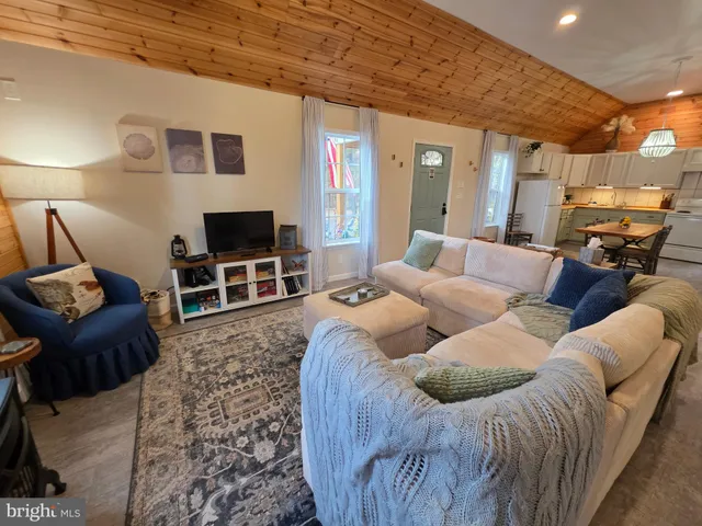 a living room with furniture and a rug
