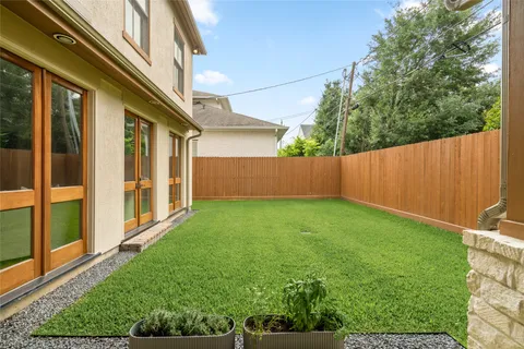 a view of a back yard from a room