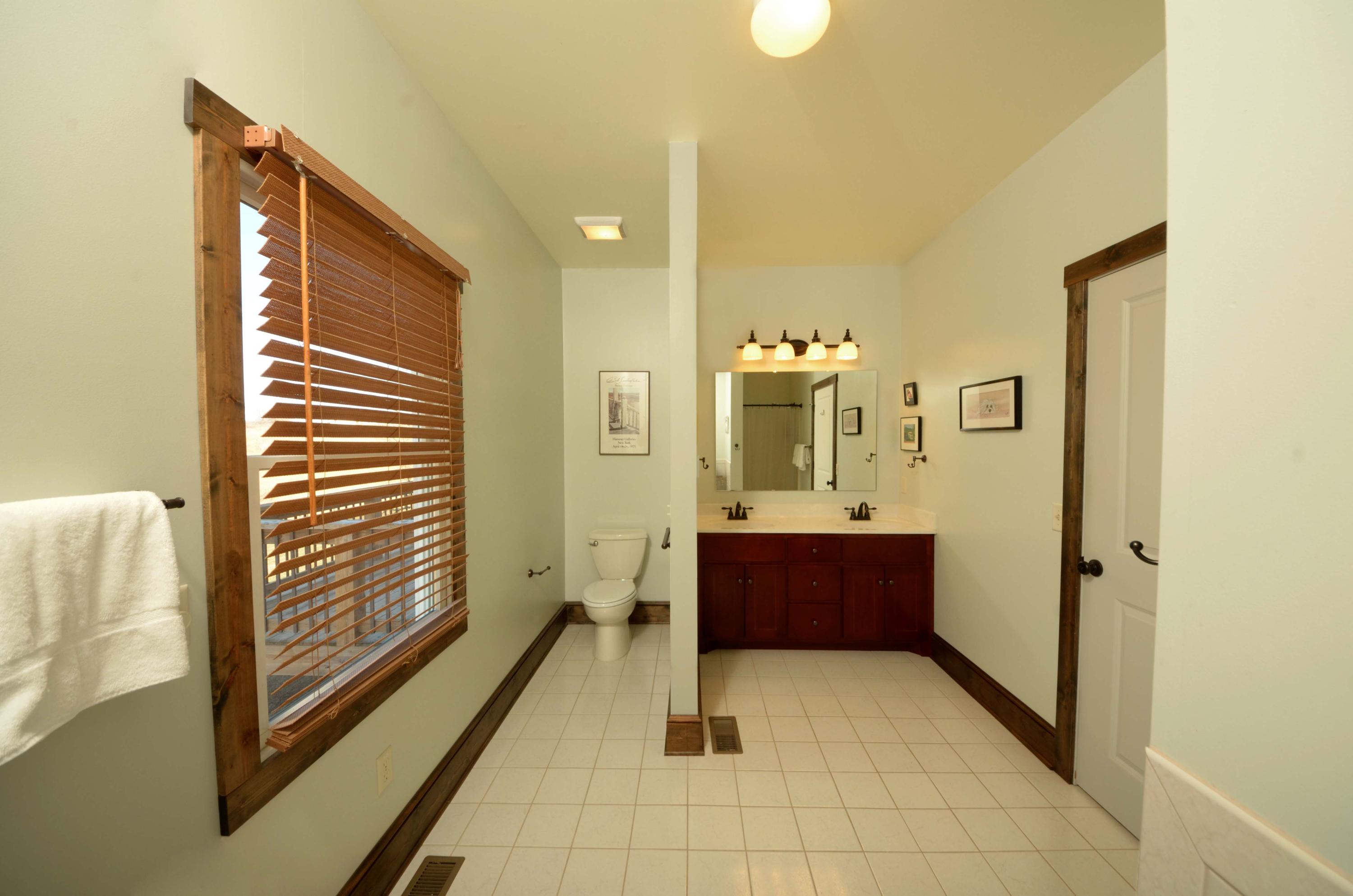 657 Poor Farm Road Southeast Floyd, VA 24091 - Photo 15 of 40 a bathroom with a tub shower and sink