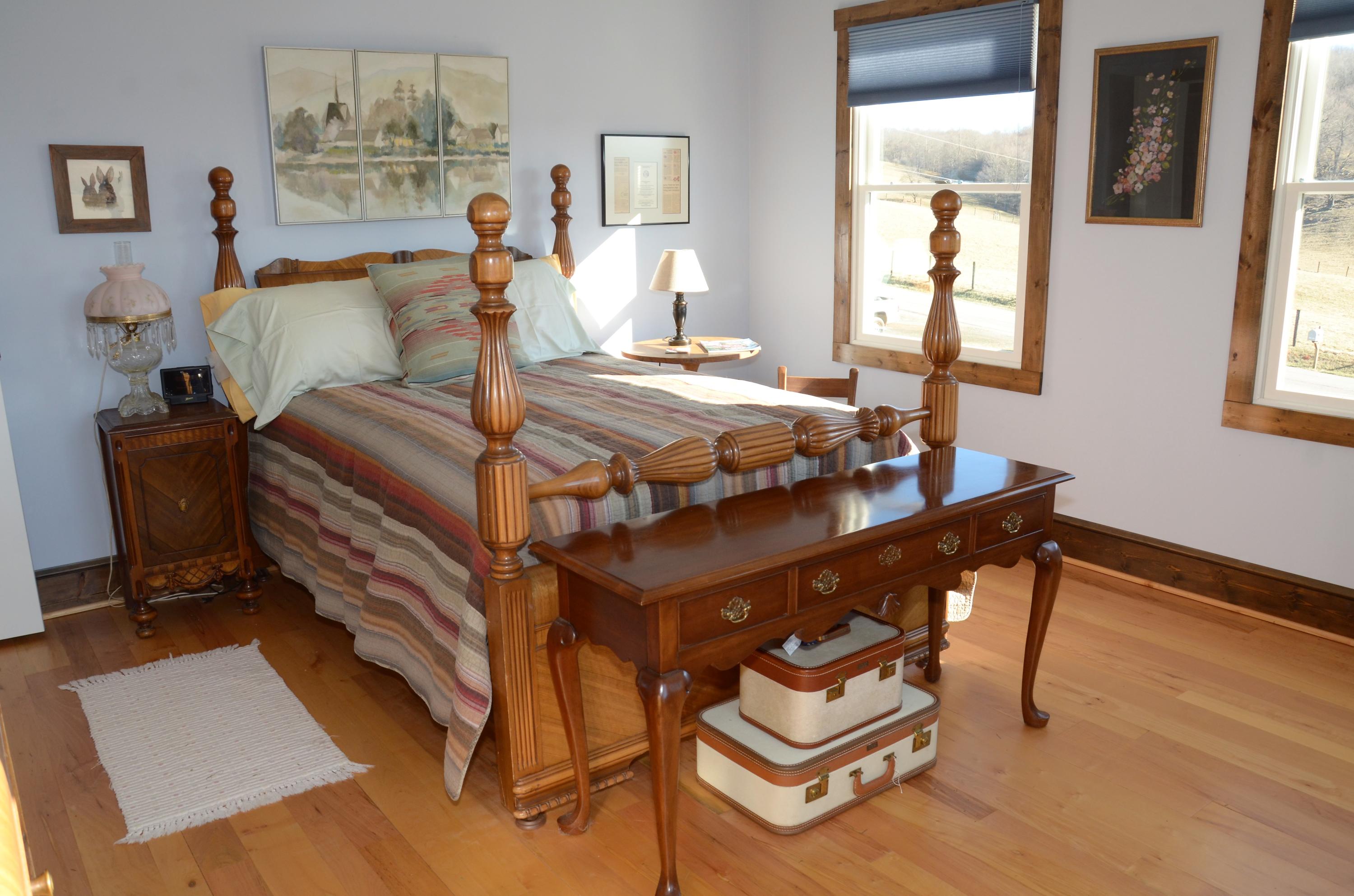 657 Poor Farm Road Southeast Floyd, VA 24091 - Photo 26 of 40 a bedroom with furniture and wooden floor