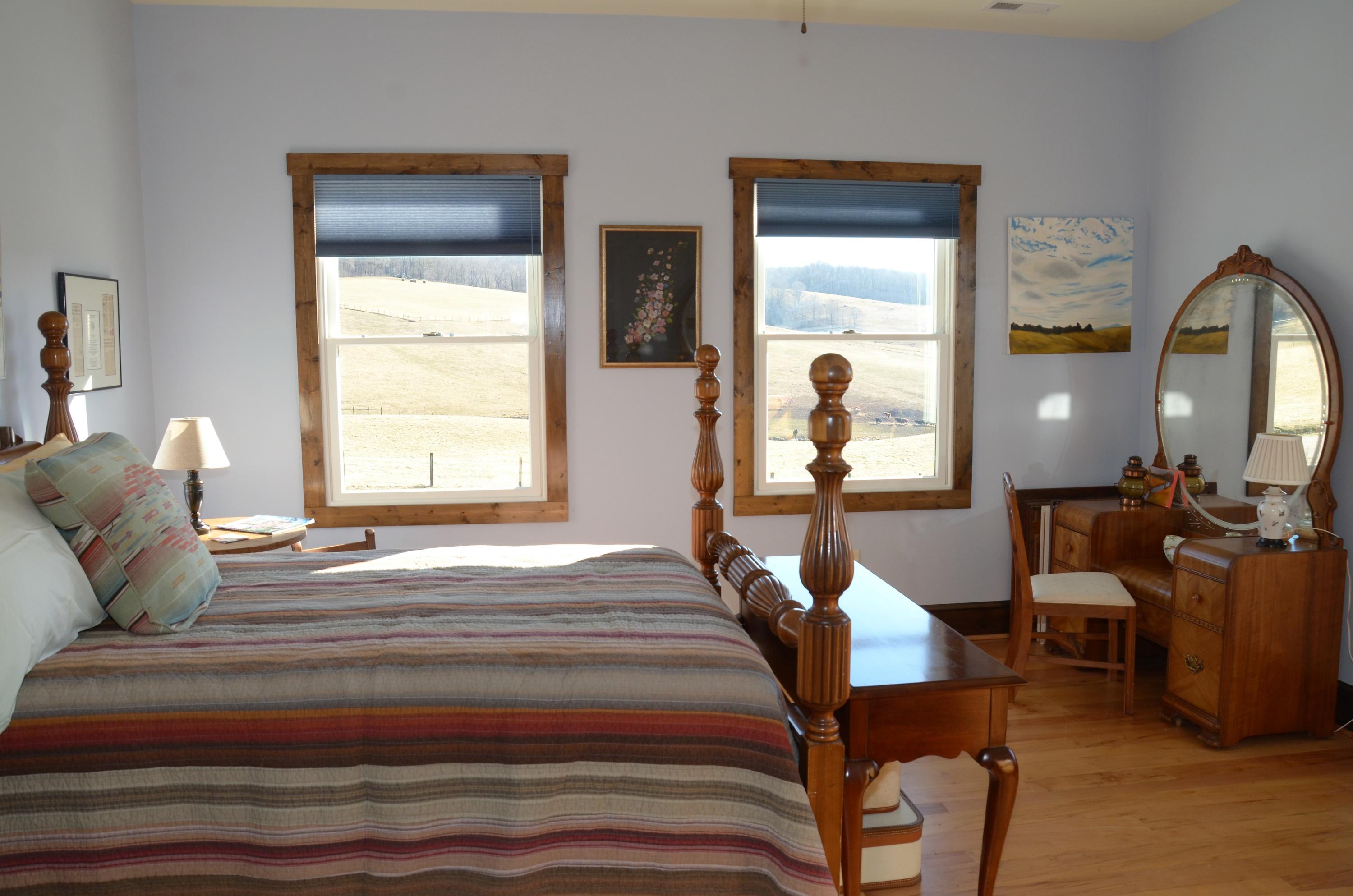 657 Poor Farm Road Southeast Floyd, VA 24091 - Photo 27 of 40 a bedroom with a bed and wooden floor