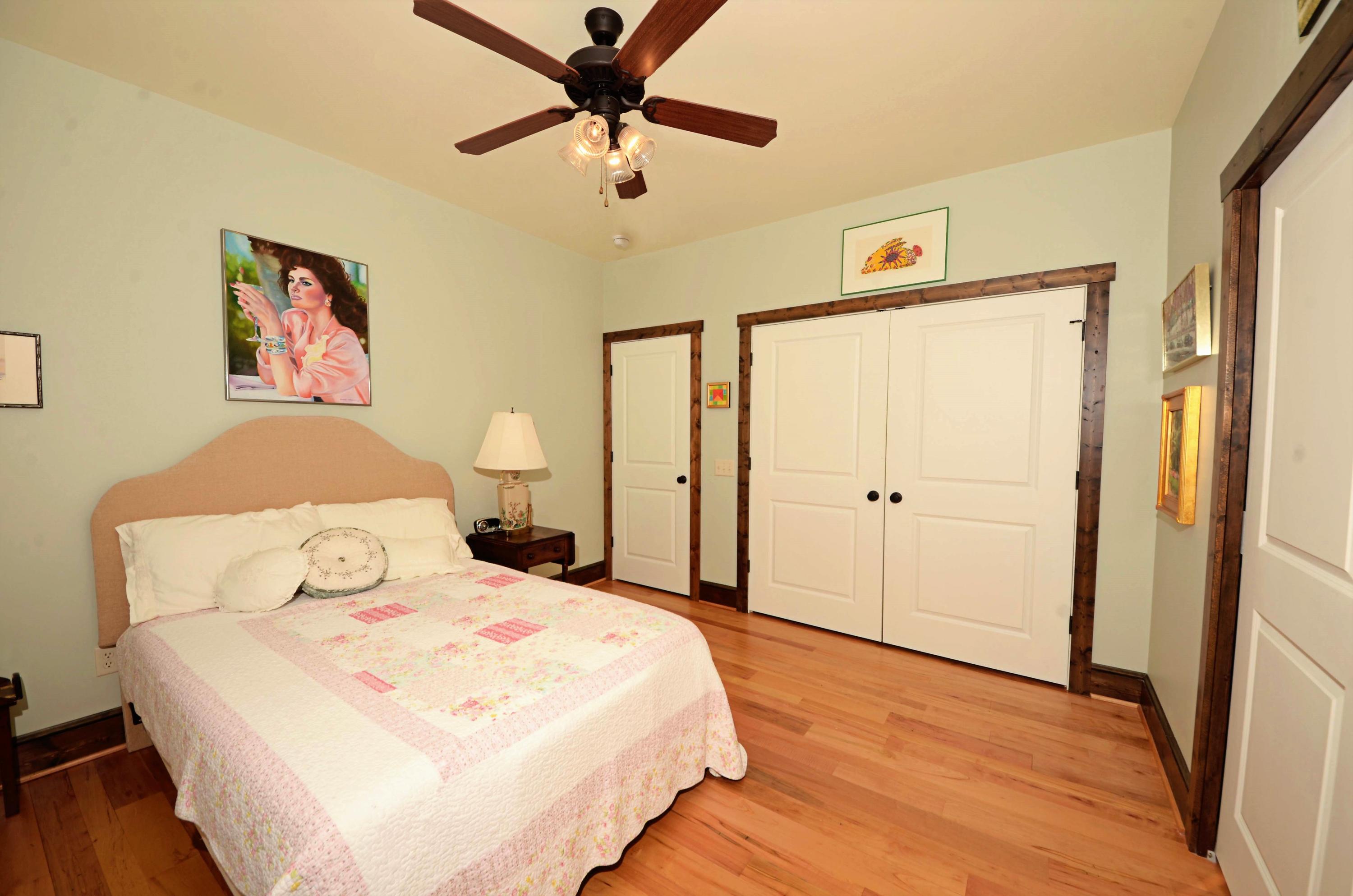 657 Poor Farm Road Southeast Floyd, VA 24091 - Photo 28 of 40 a bedroom with a bed and a painting on the wall