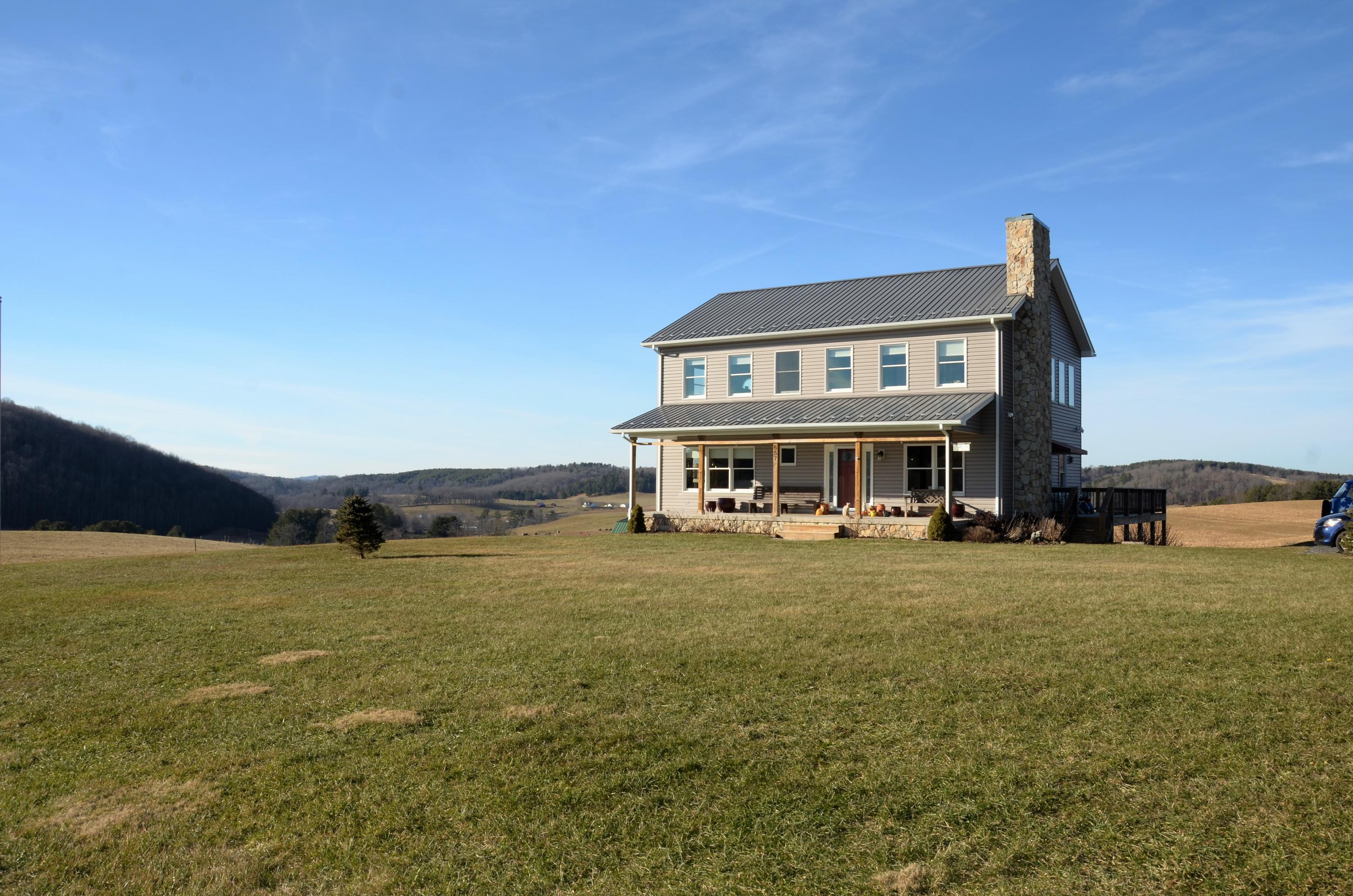 657 Poor Farm Road Southeast Floyd, VA 24091 - Photo 4 of 40 a view of a big house with a big yard and large trees