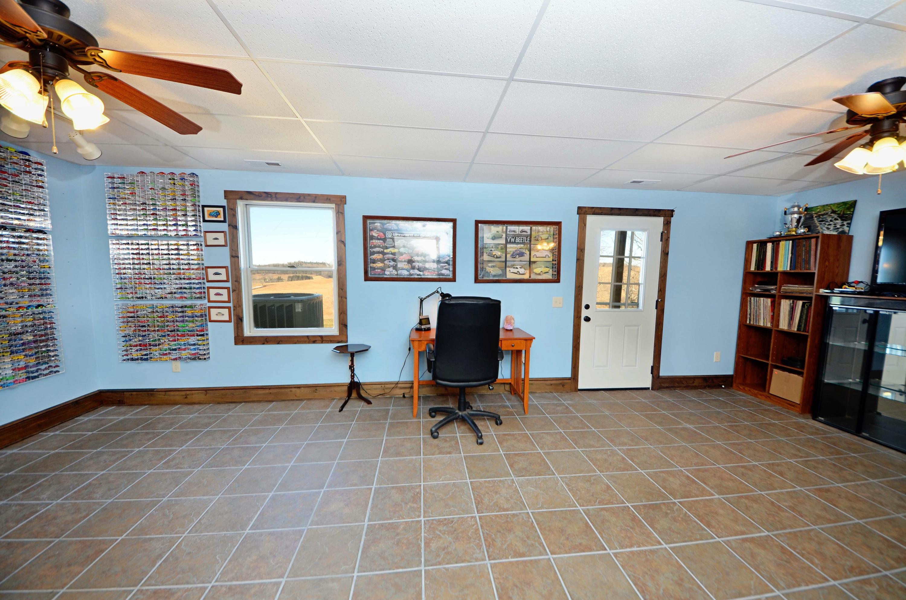 657 Poor Farm Road Southeast Floyd, VA 24091 - Photo 38 of 40 a view of a workspace with furniture and a window