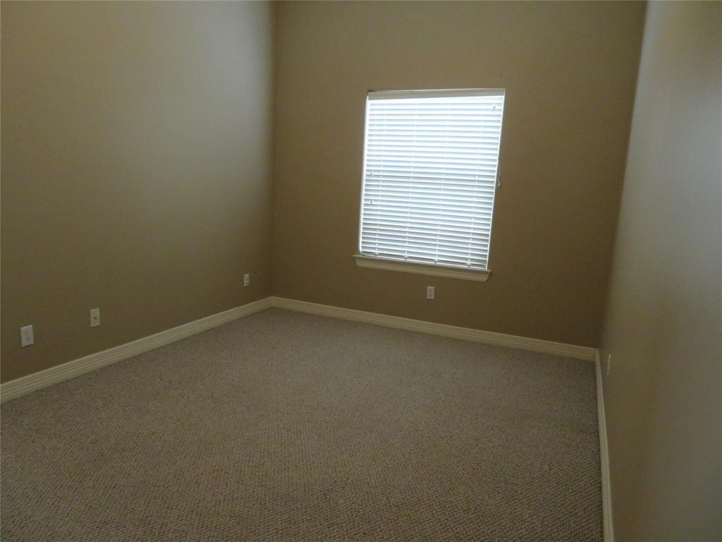 5908 Center Street Houston, TX 77007 - Photo 14 of 17 an empty room with a window