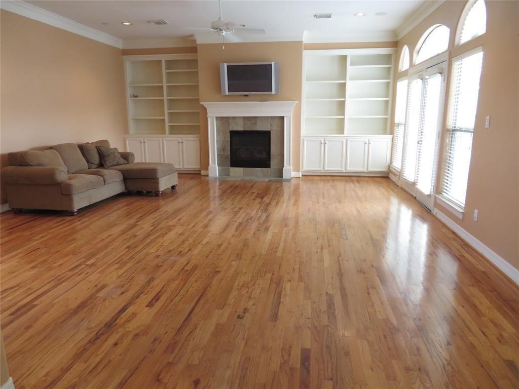 5908 Center Street Houston, TX 77007 - Photo 5 of 17 a living room with furniture and a fireplace