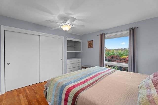 a bedroom with a bed and a tv