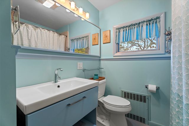 a bedroom with a bed and a table