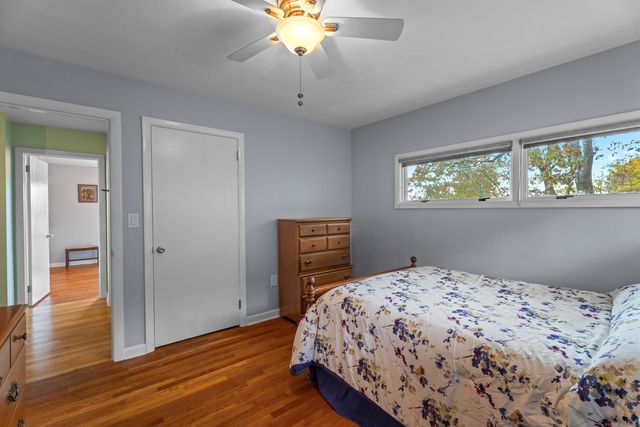 a bedroom with bed and a window