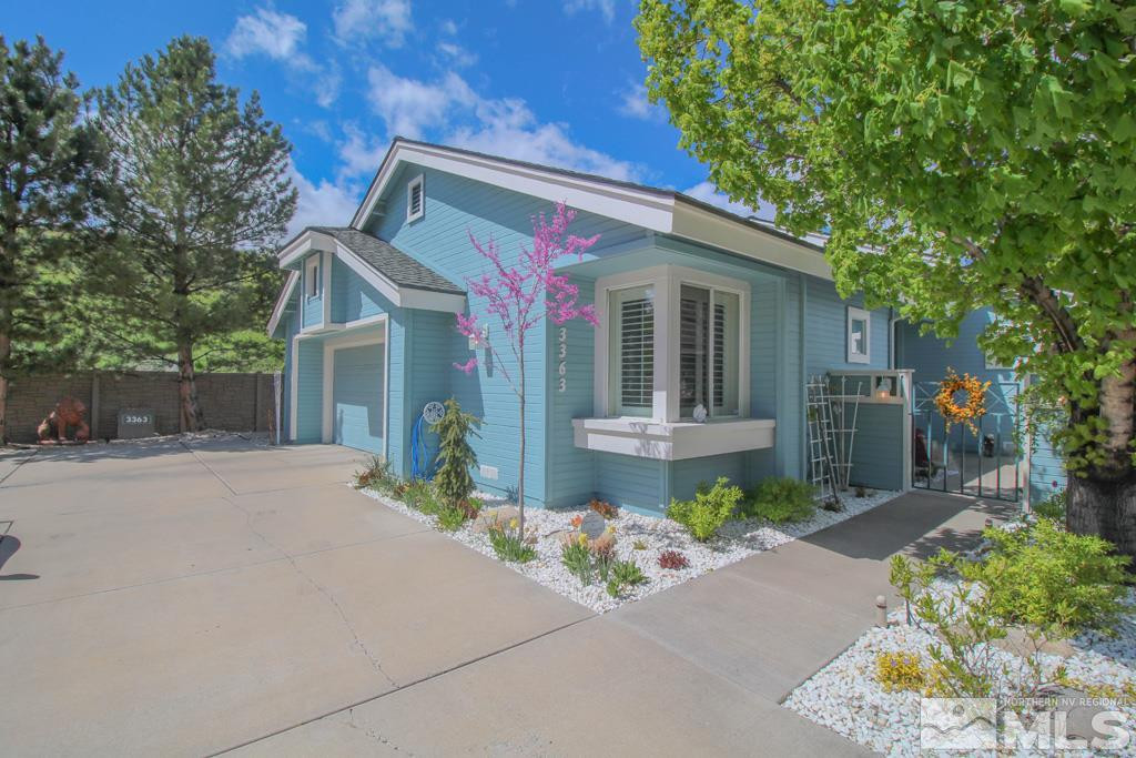 3363 Spring Creek Circle Reno, NV 89509 - Photo 1 of 1 a front view of a house with garden