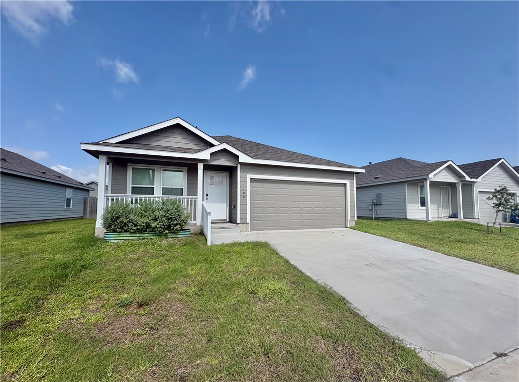 1109 Demeter Drive Portland, TX 78374 - Photo 2 of 18 a front view of a house with garden