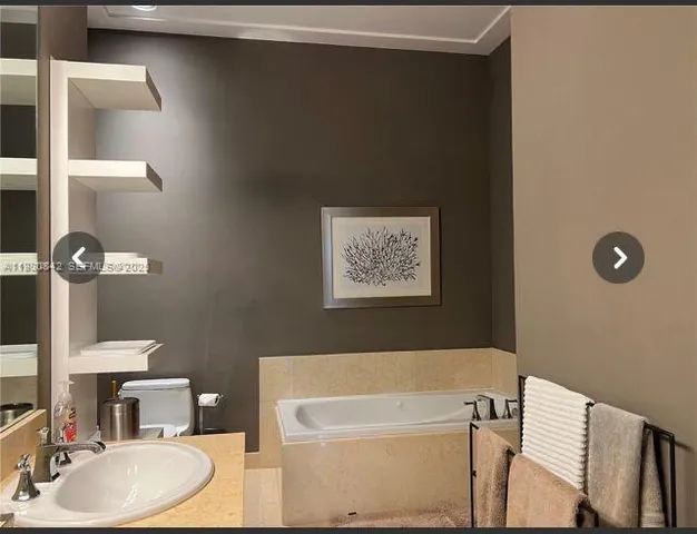 a close up of a door with a picture of a hallway