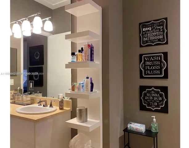 a bathroom with a shower a toilet and a sink