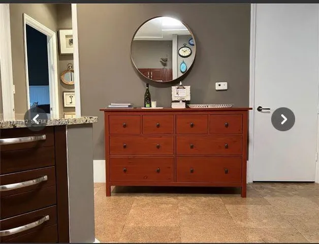 a bathroom with a mirror and a sink