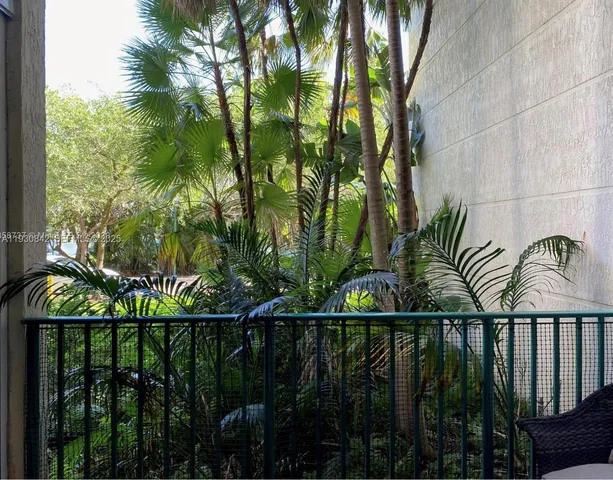 a view of a balcony with a garden and plants