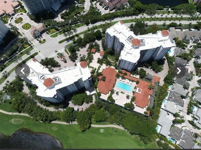 a lobby with furniture and floor to ceiling window