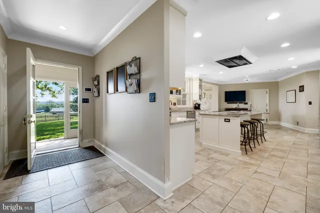 a view of a porch with wooden floor and brick walls