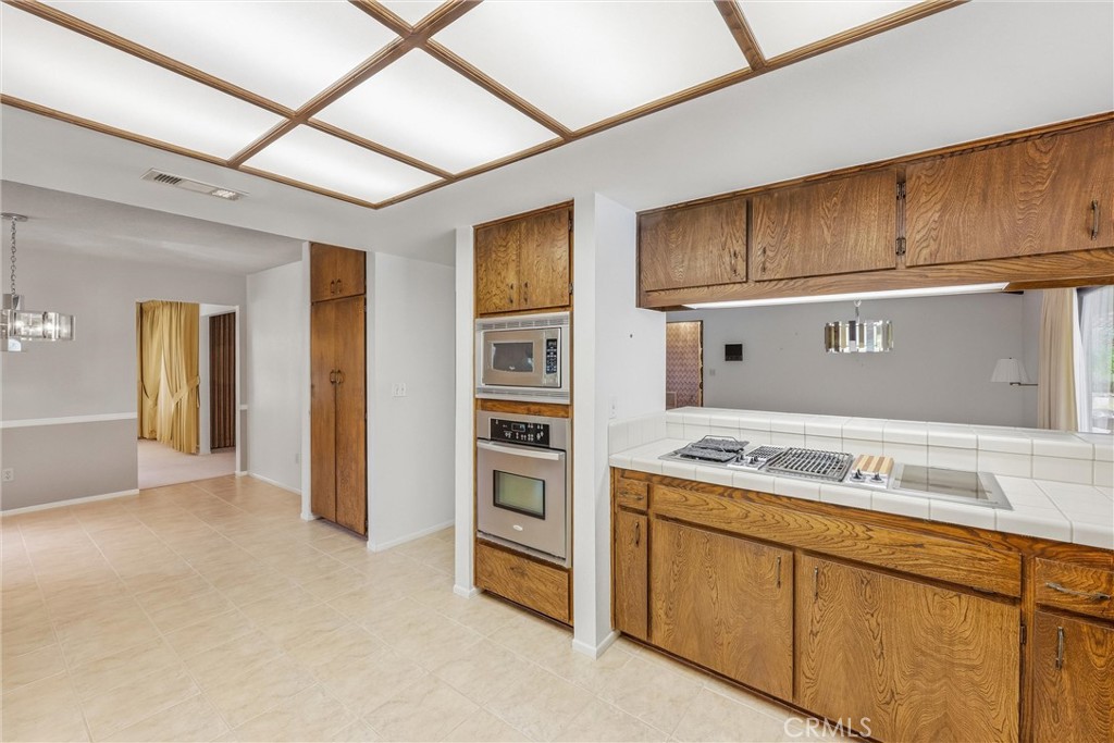 37295 Oak View Road Yucaipa, CA 92399 - Photo 17 of 59 a kitchen with cabinets and appliances