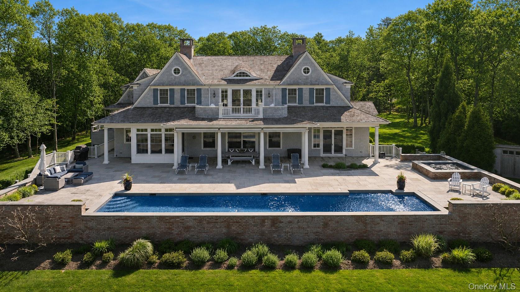 43 Old Main Road Quogue, NY 11959 - Photo 2 of 28 a front view of a house with garden