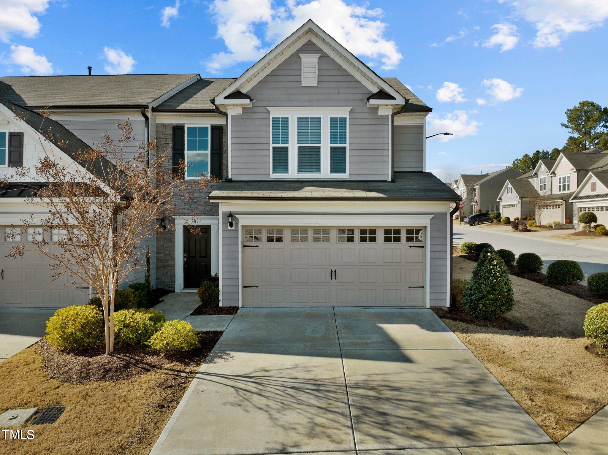 1033 Mirbeck Lane Durham, NC 27713 - Photo 1 of 37 a front view of a house with a yard and potted plants