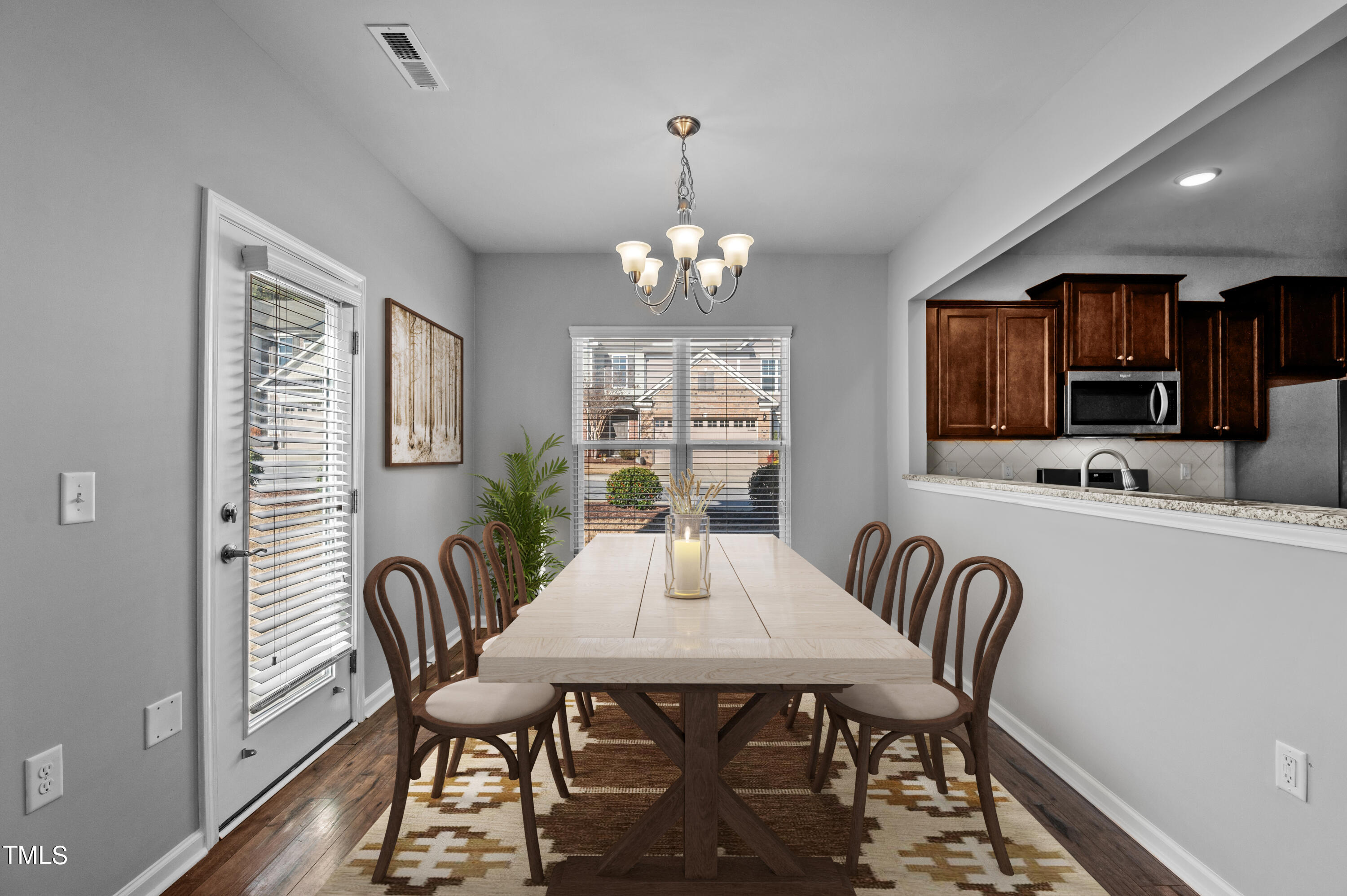 1033 Mirbeck Lane Durham, NC 27713 - Photo 15 of 37 a view of a dining room with furniture window and outside view