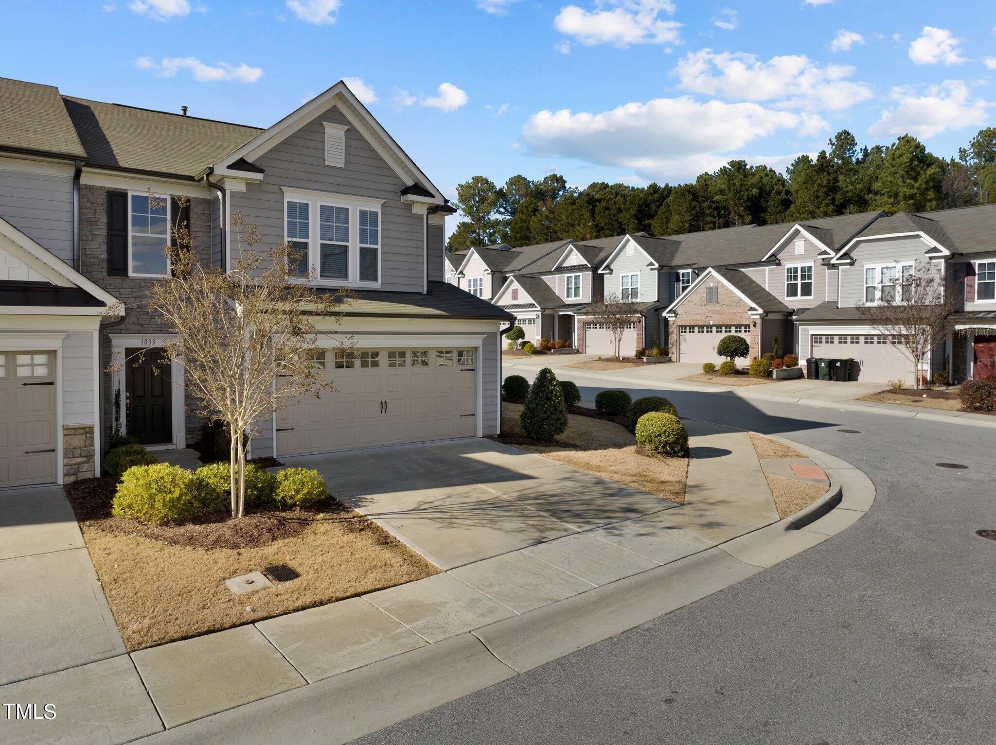 1033 Mirbeck Lane Durham, NC 27713 - Photo 2 of 37 a front view of residential houses with yard