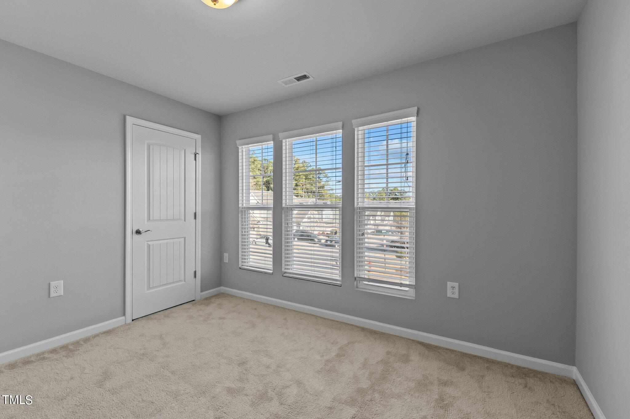 1033 Mirbeck Lane Durham, NC 27713 - Photo 21 of 37 a view of an empty room with a window