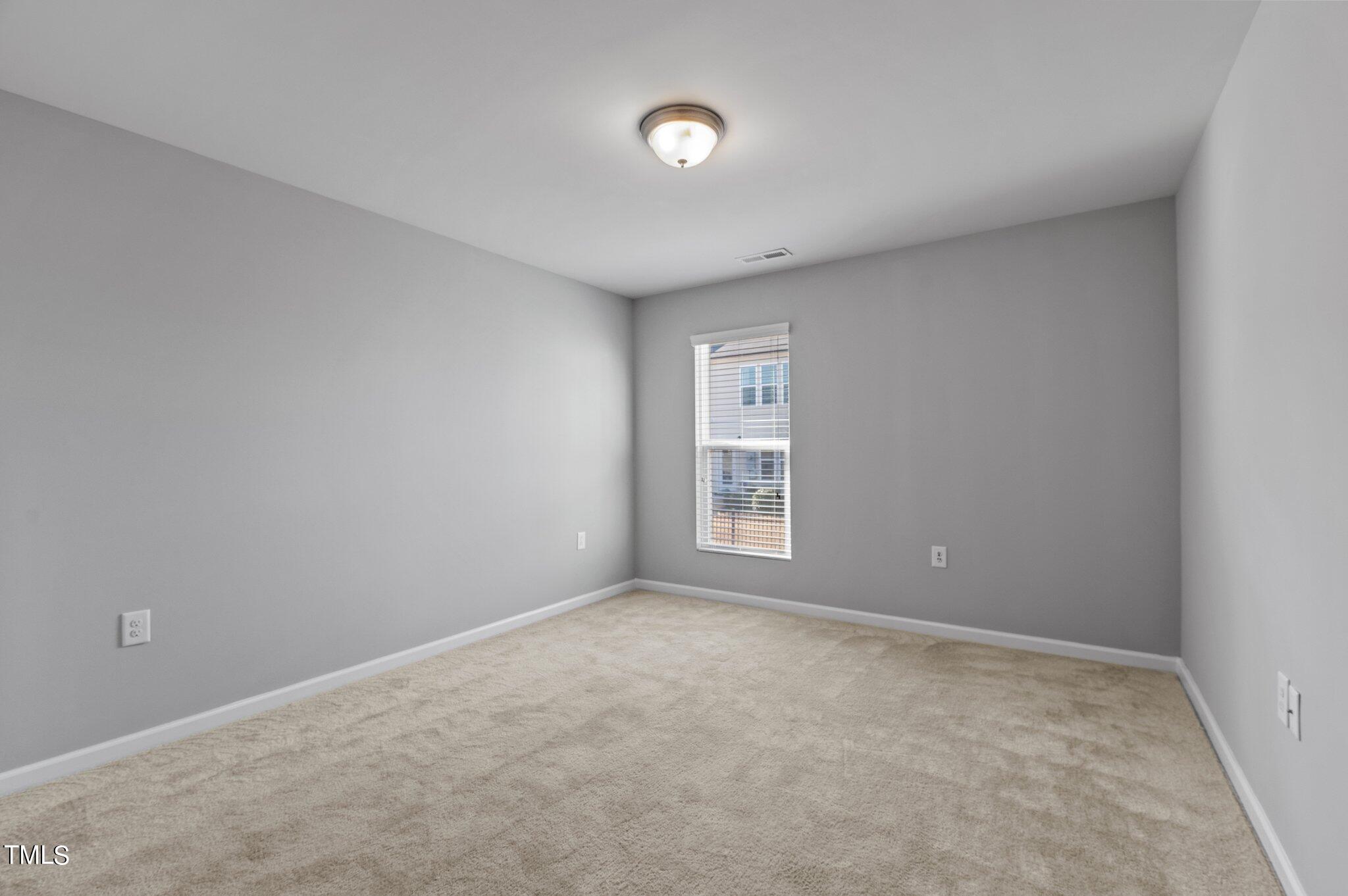 1033 Mirbeck Lane Durham, NC 27713 - Photo 23 of 37 a view of an empty room with a window