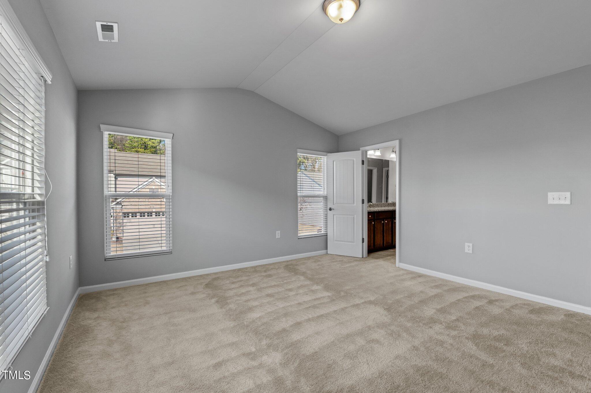 1033 Mirbeck Lane Durham, NC 27713 - Photo 27 of 37 an empty room with windows and closet