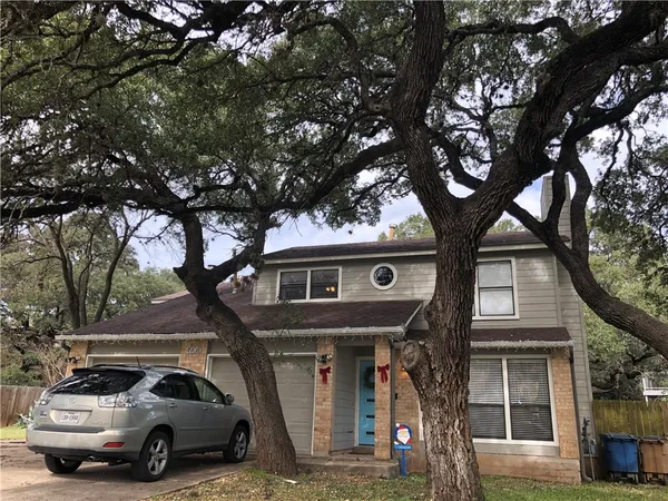 a view of a car park in front of house