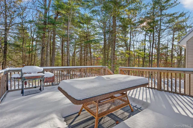 a view of a patio with a table and chairs