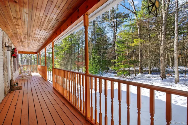 a view of balcony with wooden floor and outdoor space