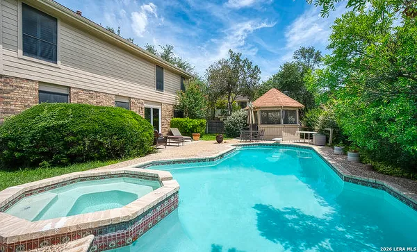 a view of a house with swimming pool