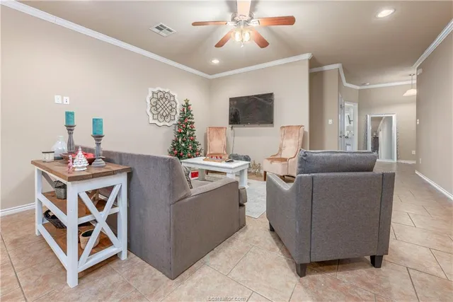 a dining room with furniture and chandelier