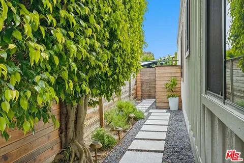 a view of a pathway with a yard