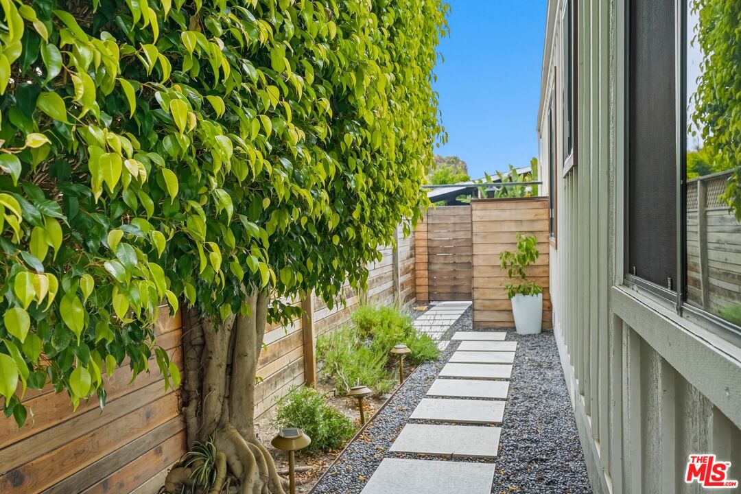 29500 Heathercliff Road, Unit 294 Malibu, CA 90265 - Photo 18 of 35 a view of a pathway with a yard