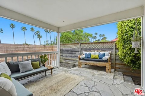 a outdoor living space with furniture and a potted plant