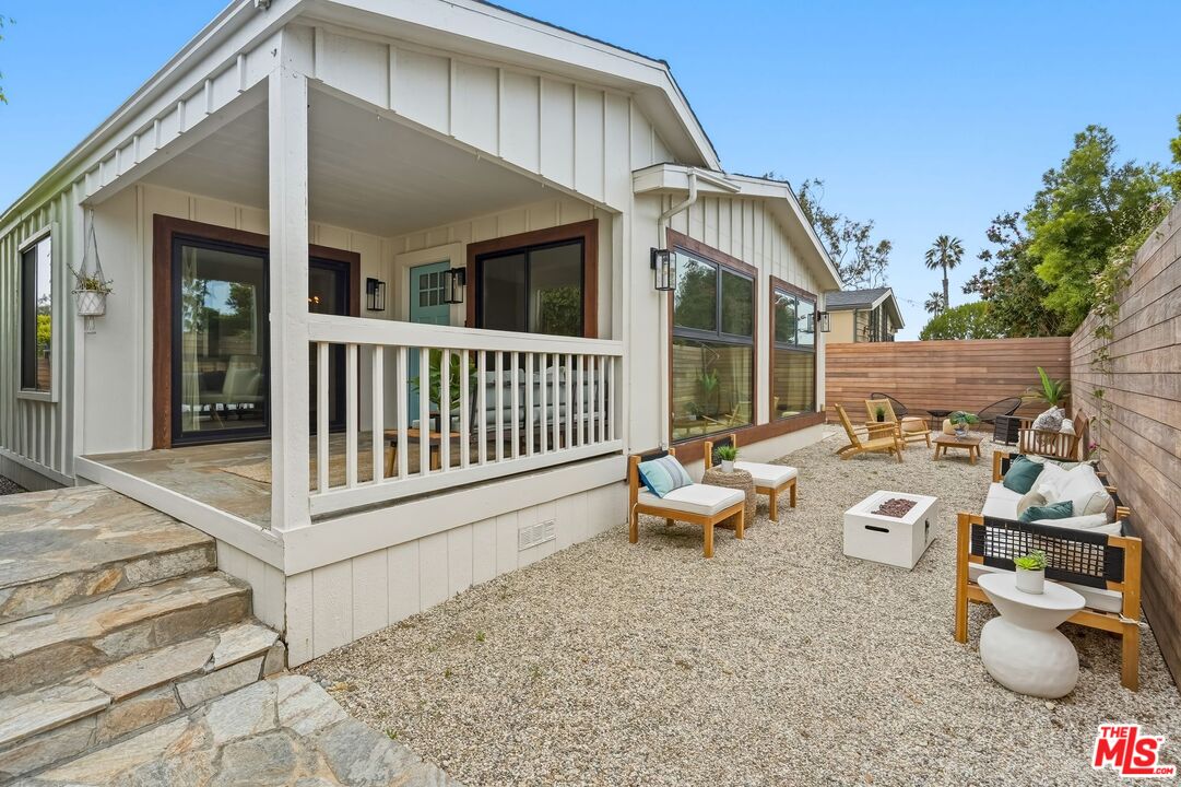 29500 Heathercliff Road, Unit 294 Malibu, CA 90265 - Photo 21 of 35 a view of a patio with couches table and chairs and potted plants