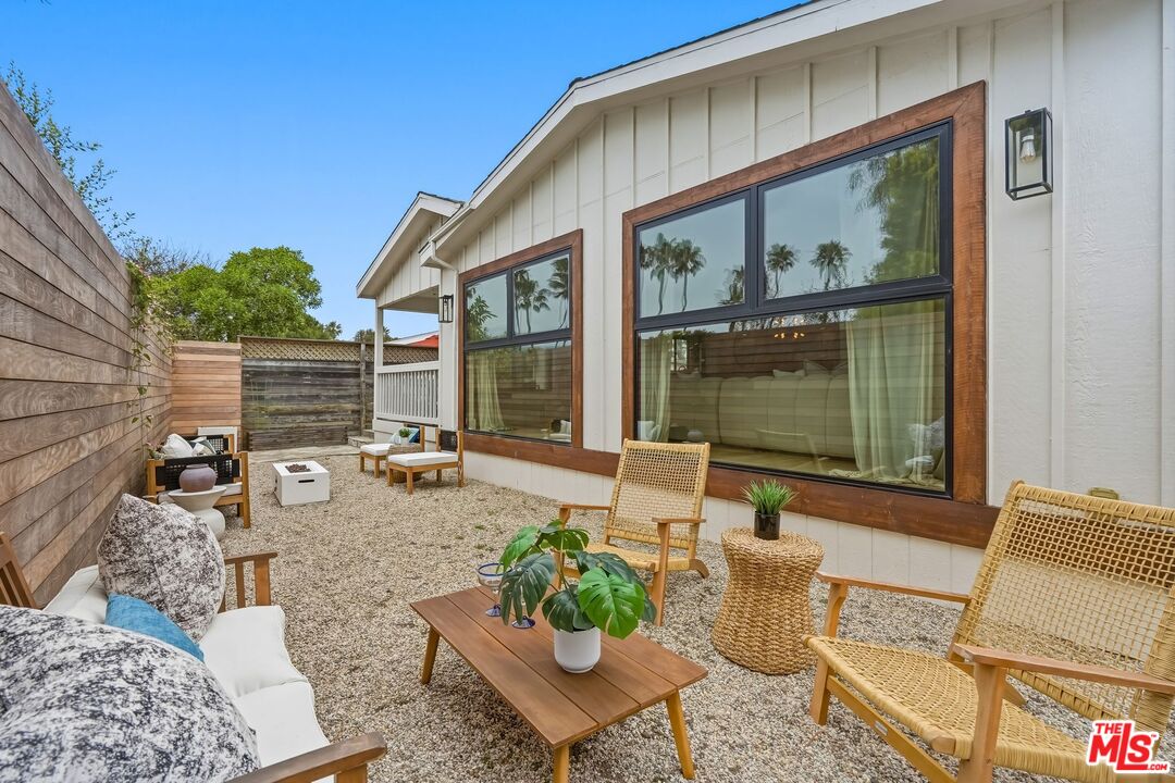 29500 Heathercliff Road, Unit 294 Malibu, CA 90265 - Photo 31 of 35 a backyard of a house with outdoor seating