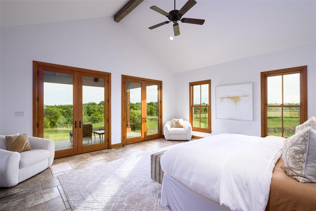 11503 East Rocky Creek Road Crowley, TX 76036 - Photo 14 of 40 a spacious bedroom with a large bed and a large window