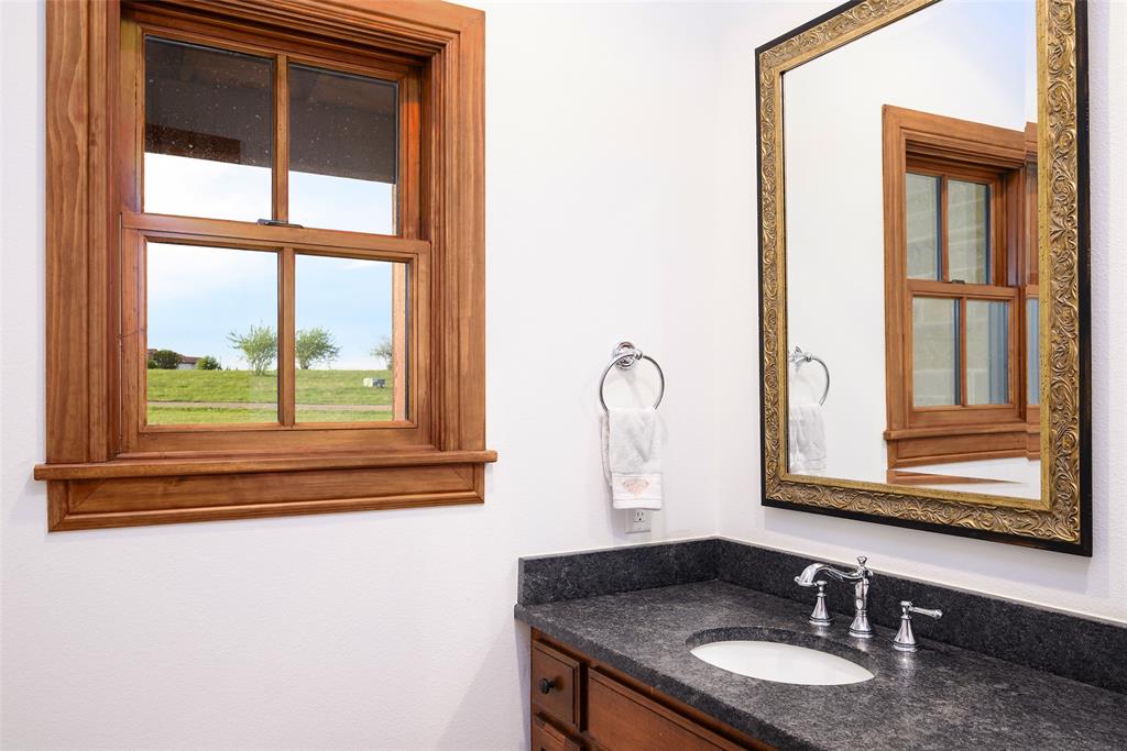 11503 East Rocky Creek Road Crowley, TX 76036 - Photo 21 of 40 a bathroom with a granite countertop sink and a window