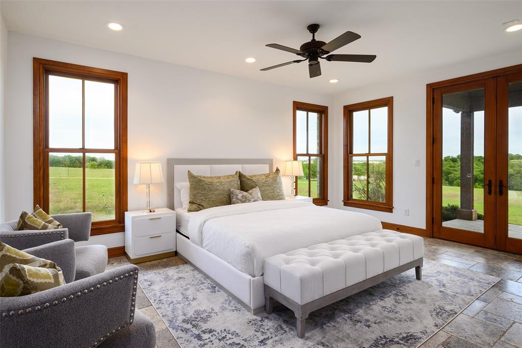11503 East Rocky Creek Road Crowley, TX 76036 - Photo 22 of 40 a bedroom with a bed couches and a large window