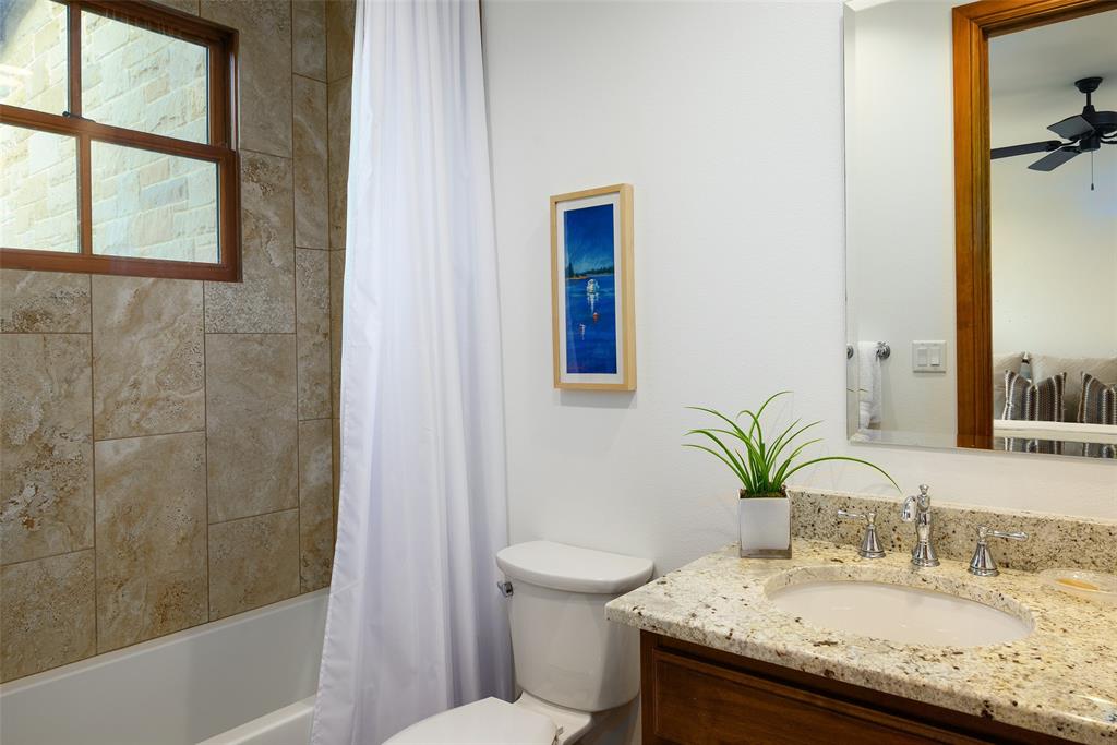 11503 East Rocky Creek Road Crowley, TX 76036 - Photo 26 of 40 a bathroom with a granite countertop sink a toilet and shower