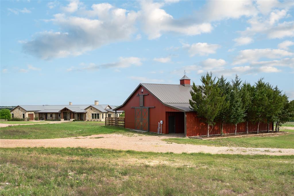 11503 East Rocky Creek Road Crowley, TX 76036 - Photo 32 of 40 a view of a house with a big yard and large trees
