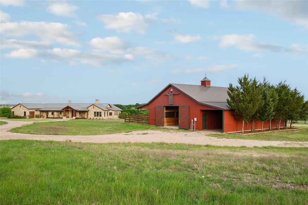 11503 East Rocky Creek Road Crowley, TX 76036 - Photo 34 of 40 a front view of a house with a yard and garage