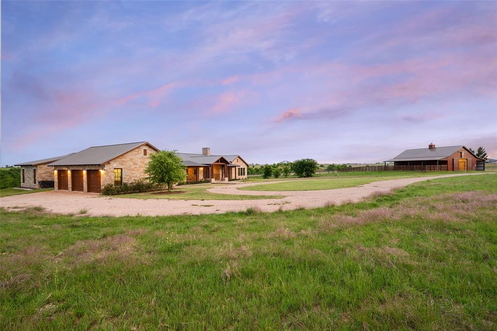 11503 East Rocky Creek Road Crowley, TX 76036 - Photo 35 of 40 a view of a house with a yard and a large tree center