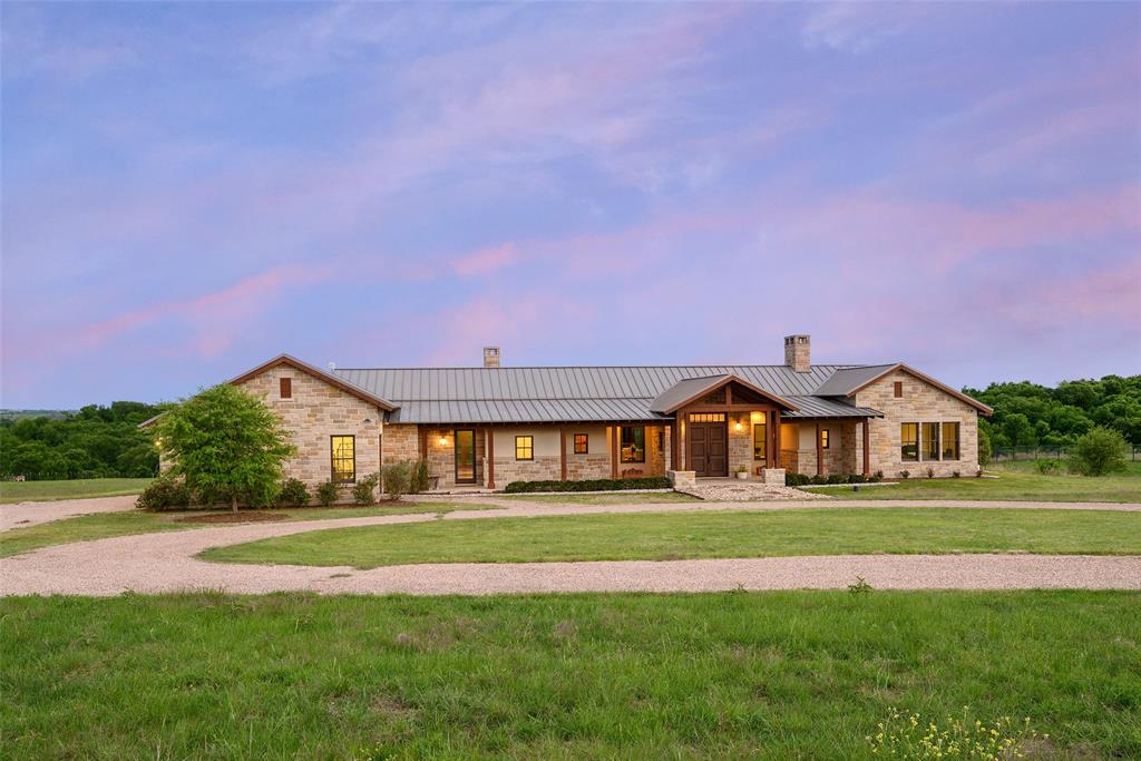 11503 East Rocky Creek Road Crowley, TX 76036 - Photo 36 of 40 a front view of a house with a big yard and potted plants