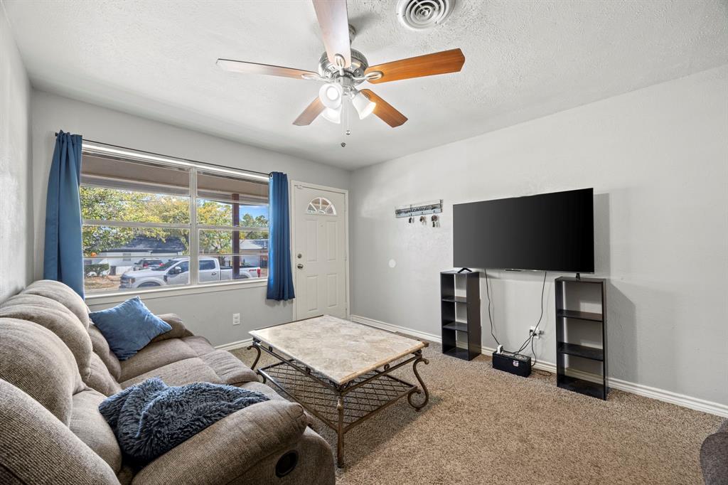 4812 Marshall Street Forest Hill, TX 76119 - Photo 3 of 10 a living room with furniture and a flat screen tv